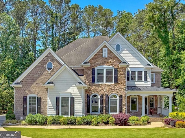 1575 Petal Pt NW, Kennesaw, GA 30152 - colonial-style house featuring a front yard, a porch, a standing seam roof, stone siding, and a shingled roof