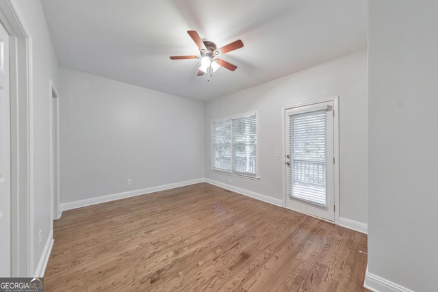 1575 Petal Pt NW, Kennesaw, GA 30152 - spare room featuring ceiling fan, wood finished floors, and baseboards