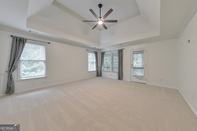 1575 Petal Pt NW, Kennesaw, GA 30152 - spare room with a tray ceiling, healthy amount of natural light, and a ceiling fan