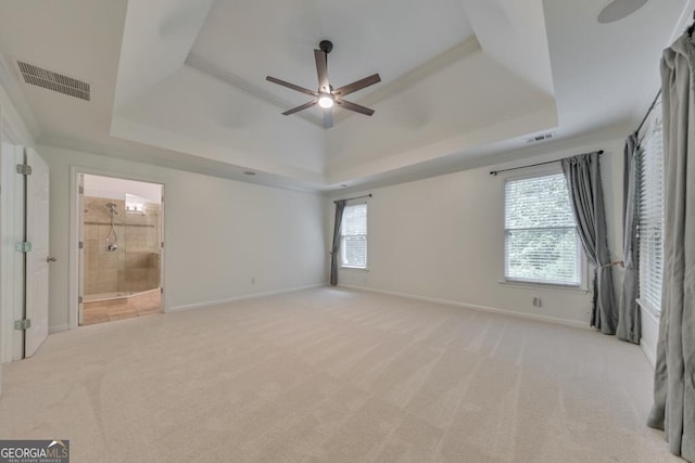 1575 Petal Pt NW, Kennesaw, GA 30152 - unfurnished bedroom with a tray ceiling, light colored carpet, and baseboards