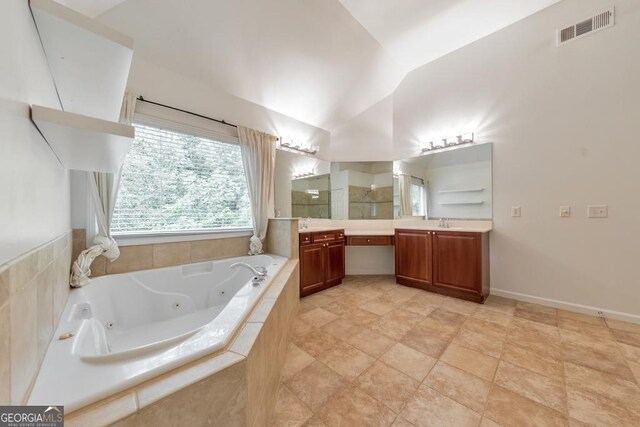 1575 Petal Pt NW, Kennesaw, GA 30152 - full bath featuring double vanity, a tub with jets, vaulted ceiling, and tiled shower
