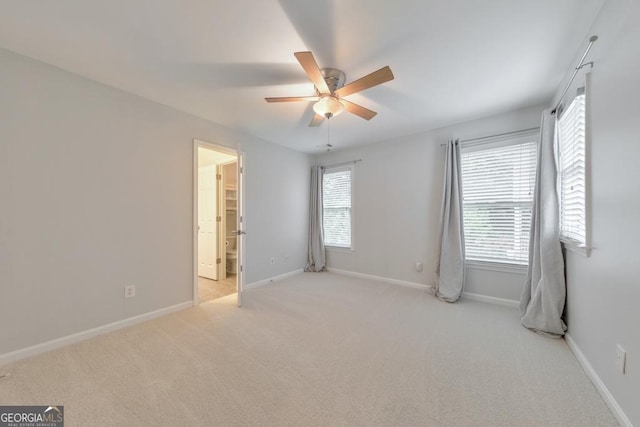 1575 Petal Pt NW, Kennesaw, GA 30152 - unfurnished bedroom with carpet floors, baseboards, a ceiling fan, and ensuite bath