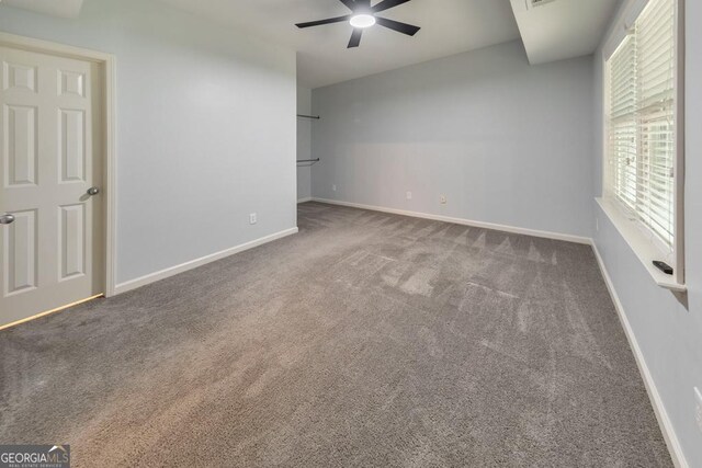 1575 Petal Pt NW, Kennesaw, GA 30152 - unfurnished bedroom with carpet floors, baseboards, and a ceiling fan