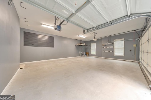 1575 Petal Pt NW, Kennesaw, GA 30152 - garage featuring a garage door opener and baseboards