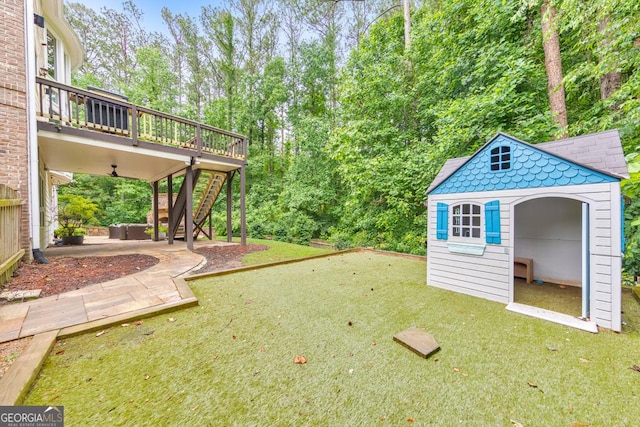 1575 Petal Pt NW, Kennesaw, GA 30152 - view of grassy yard featuring stairs, a wooden deck, a patio area, and an outbuilding