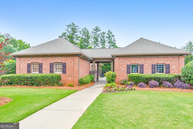 1575 Petal Pt NW, Kennesaw, GA 30152 - view of front facade featuring brick siding, roof with shingles, and a gate