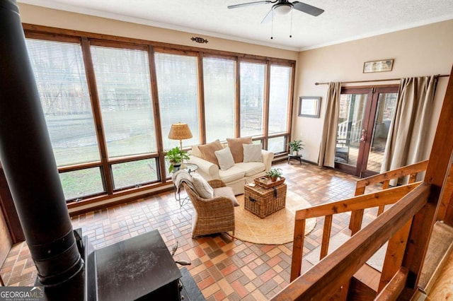 2796 County Line Rd NW, Acworth, GA 30101 - living room with a ceiling fan, ornamental molding, and brick patterned floors