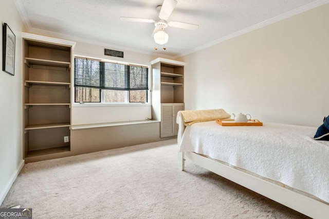 2796 County Line Rd NW, Acworth, GA 30101 - carpeted bedroom featuring ornamental molding, a closet, a ceiling fan, and a textured ceiling