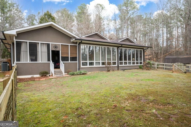 2796 County Line Rd NW, Acworth, GA 30101 - back of house featuring a sunroom and central air condition unit
