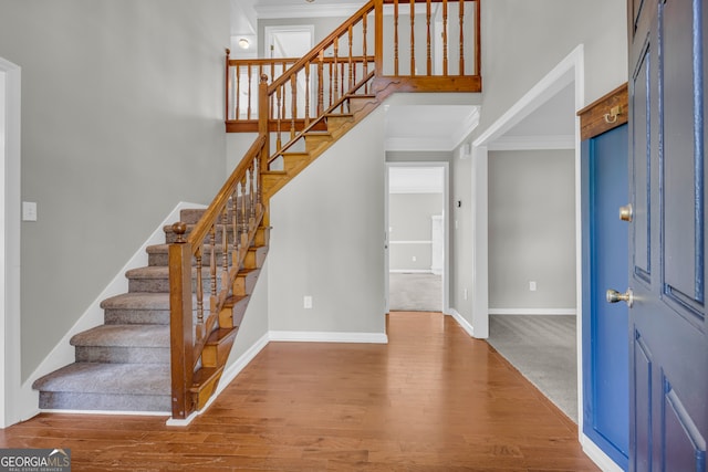 2151 Hamstead Ct, Suwanee, GA 30024 - foyer featuring ornamental molding, wood finished floors, stairs, and baseboards