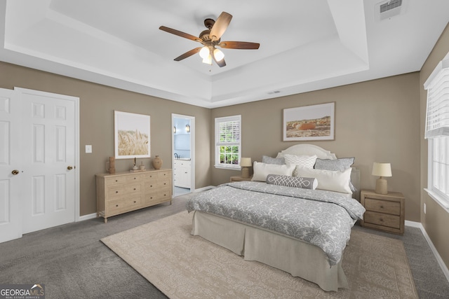 2151 Hamstead Ct, Suwanee, GA 30024 - bedroom with a raised ceiling, carpet, baseboards, and ensuite bath