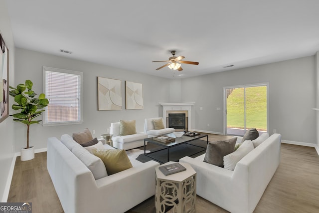 955 Mill Creek Ave, Canton, GA 30115 - living area with a ceiling fan, a fireplace, wood finished floors, and baseboards