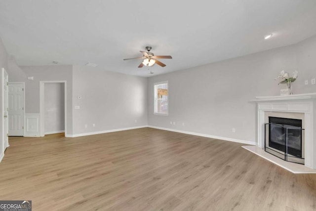 955 Mill Creek Ave, Canton, GA 30115 - unfurnished living room featuring ceiling fan, light wood finished floors, a premium fireplace, and baseboards
