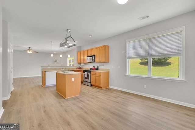 955 Mill Creek Ave, Canton, GA 30115 - kitchen with appliances with stainless steel finishes, a center island, plenty of natural light, light wood finished floors, and recessed lighting