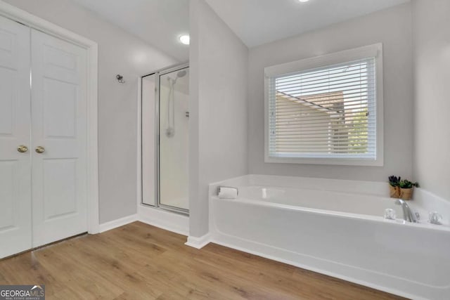 955 Mill Creek Ave, Canton, GA 30115 - full bath featuring a garden tub, a shower stall, baseboards, and wood finished floors