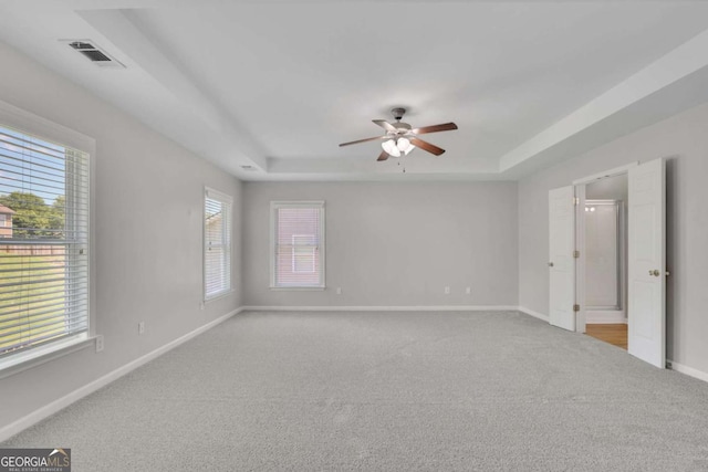 955 Mill Creek Ave, Canton, GA 30115 - carpeted empty room featuring a tray ceiling, a ceiling fan, and baseboards