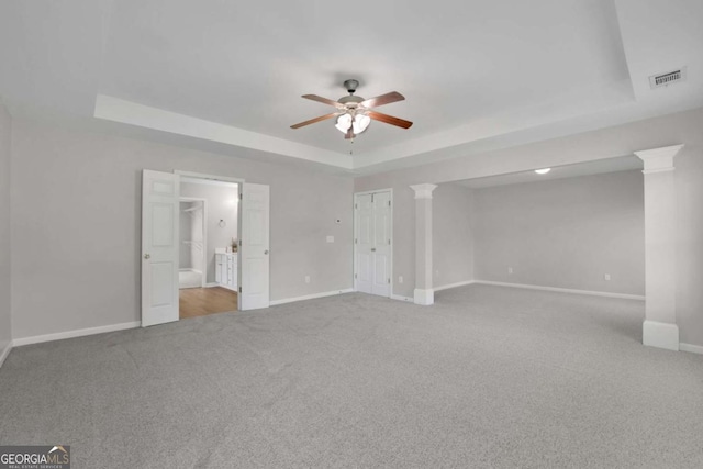 955 Mill Creek Ave, Canton, GA 30115 - unfurnished bedroom with a tray ceiling, carpet, baseboards, a ceiling fan, and decorative columns