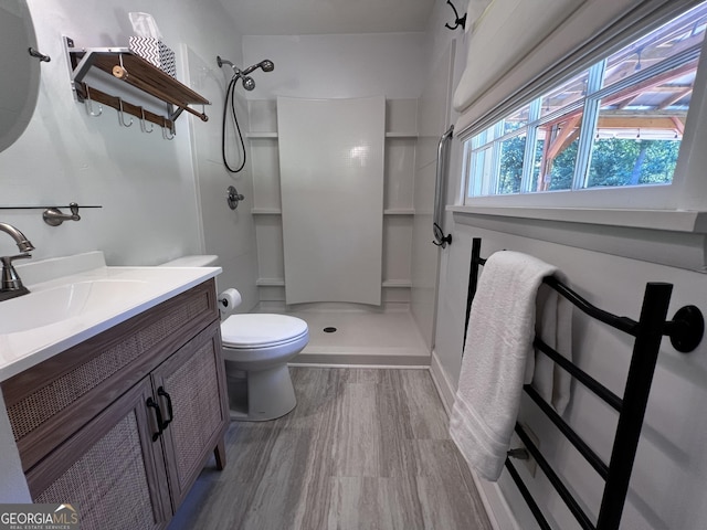 2976 Twin Pine Rd, Thomson, GA 30824 - full bathroom featuring a shower, toilet, vanity, and baseboards