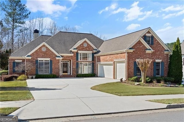 4115 Gold Mill Rdg, Canton, GA 30114 - colonial-style house with brick siding, a front lawn, and a chimney