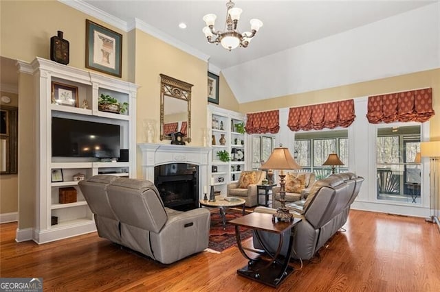 4115 Gold Mill Rdg, Canton, GA 30114 - living room with wood finished floors, a fireplace, a chandelier, crown molding, and lofted ceiling