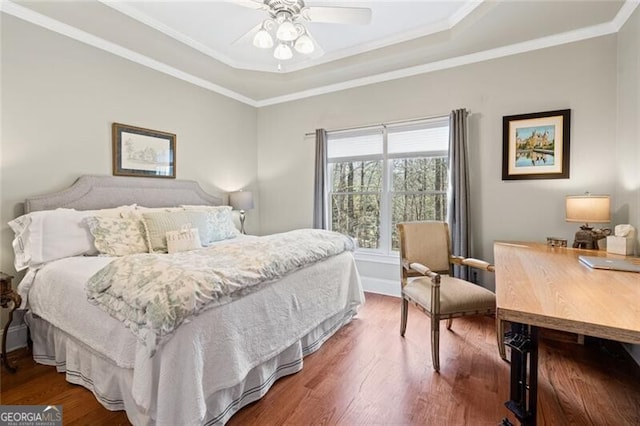 4115 Gold Mill Rdg, Canton, GA 30114 - bedroom featuring wood finished floors, a raised ceiling, an office area, ornamental molding, and a ceiling fan