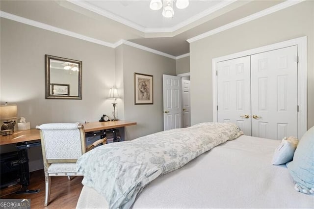 4115 Gold Mill Rdg, Canton, GA 30114 - bedroom featuring wood finished floors, a desk, a closet, and ornamental molding