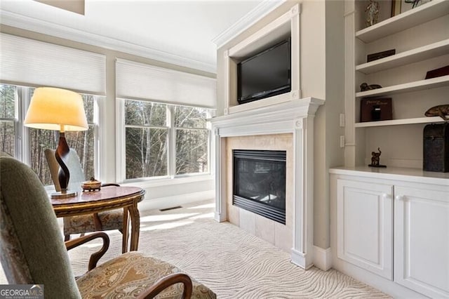 4115 Gold Mill Rdg, Canton, GA 30114 - living area with light colored carpet, ornamental molding, a tile fireplace, baseboards, and built in shelves