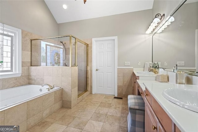 4115 Gold Mill Rdg, Canton, GA 30114 - full bath with double vanity, a bath, a stall shower, tile patterned floors, and tile walls
