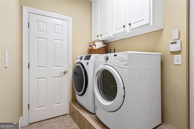 4115 Gold Mill Rdg, Canton, GA 30114 - washroom with washer and dryer, cabinet space, and light tile patterned floors