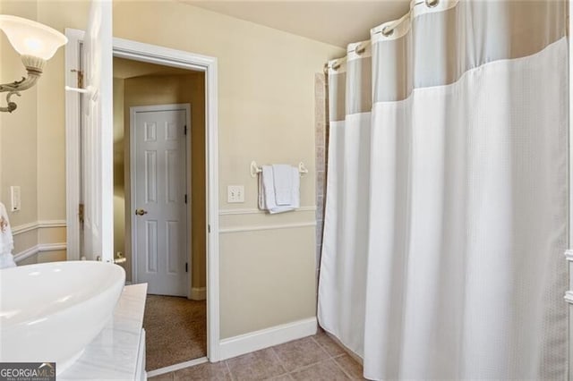 4115 Gold Mill Rdg, Canton, GA 30114 - bathroom featuring tile patterned floors, curtained shower, and baseboards