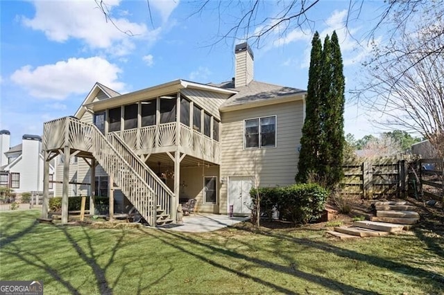 4115 Gold Mill Rdg, Canton, GA 30114 - rear view of house featuring a sunroom, a patio area, stairway, and a chimney