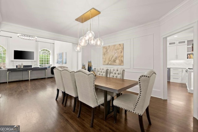 5120 Falcon Chase Ln, Atlanta, GA 30342 - dining space featuring ornamental molding, dark wood-type flooring, a decorative wall, and a chandelier