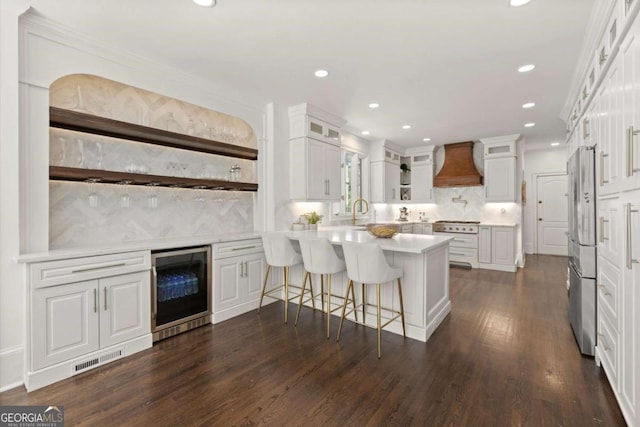 5120 Falcon Chase Ln, Atlanta, GA 30342 - kitchen with premium range hood, wine cooler, a peninsula, backsplash, and stainless steel refrigerator