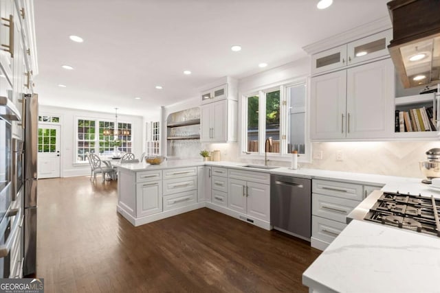 5120 Falcon Chase Ln, Atlanta, GA 30342 - kitchen featuring dishwasher, a sink, a peninsula, light stone countertops, and recessed lighting