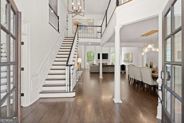 5120 Falcon Chase Ln, Atlanta, GA 30342 - foyer with a chandelier, a high ceiling, stairway, ornamental molding, and dark wood-style floors