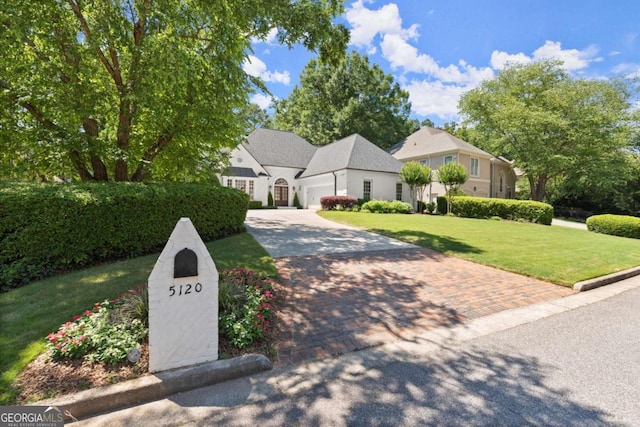 5120 Falcon Chase Ln, Atlanta, GA 30342 - view of front of home with driveway, a front yard, and an attached garage