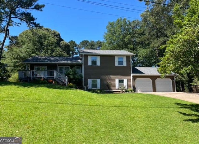 710 Wind Song Trce, Woodstock, GA 30189 - tri-level home featuring an attached garage, a front yard, and concrete driveway