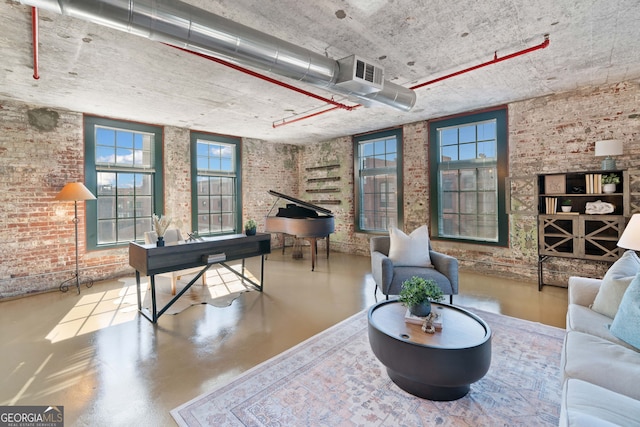 170 Boulevard E414, Atlanta, GA 30312 - living area featuring finished concrete flooring and brick wall