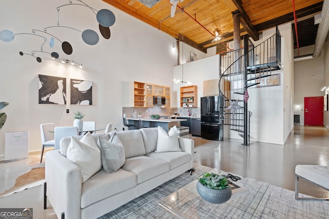170 Boulevard E414, Atlanta, GA 30312 - living room featuring wooden ceiling with exposed beams, a high ceiling, and stairway