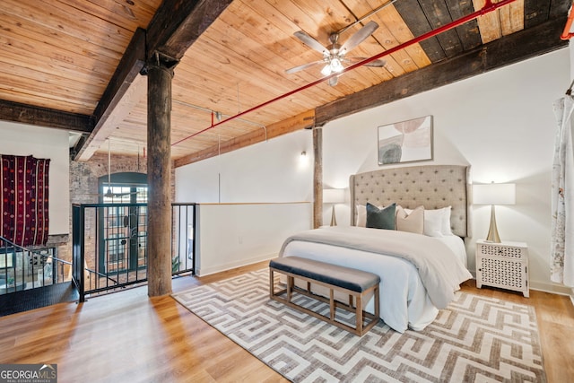 170 Boulevard E414, Atlanta, GA 30312 - bedroom with wood ceiling with exposed beams, wood finished floors, and baseboards