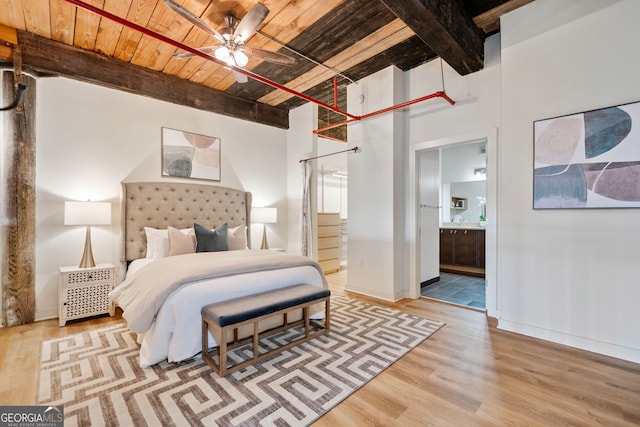 170 Boulevard E414, Atlanta, GA 30312 - bedroom featuring wooden ceiling with exposed beams, wood finished floors, connected bathroom, and baseboards
