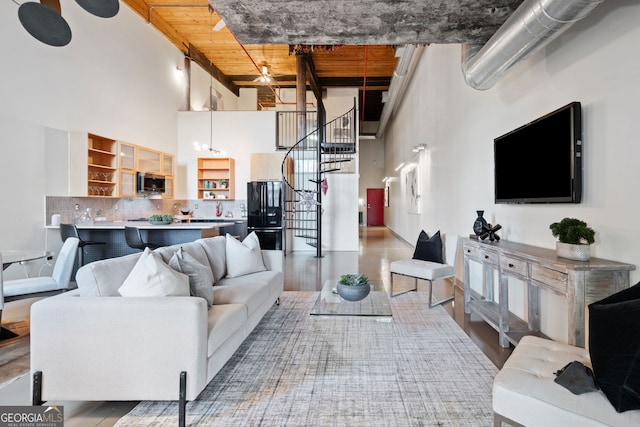 170 Boulevard E414, Atlanta, GA 30312 - living area with a towering ceiling, stairway, and wood finished floors