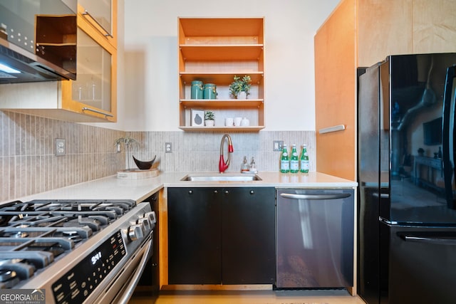 170 Boulevard E414, Atlanta, GA 30312 - kitchen featuring stainless steel appliances, a sink, open shelves, light countertops, and decorative backsplash