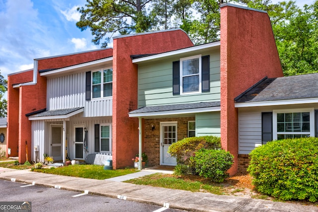 39 Helmsman Ct, Savannah, GA 31410 - view of property with a chimney and board and batten siding