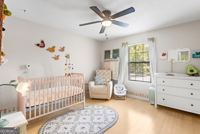 39 Helmsman Ct, Savannah, GA 31410 - bedroom with a nursery area, wood finished floors, and ceiling fan