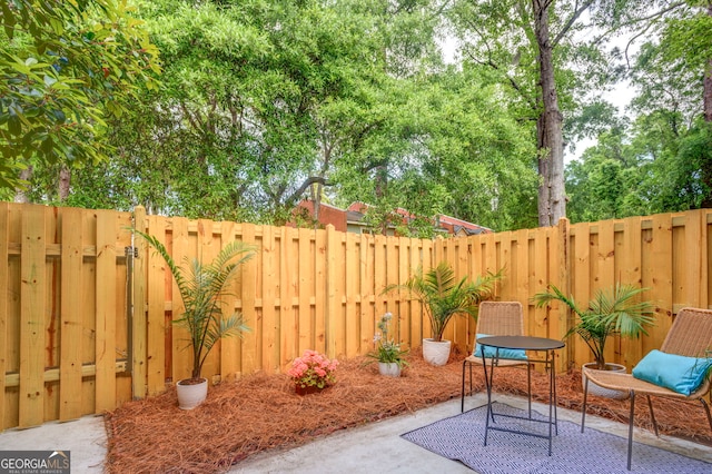 39 Helmsman Ct, Savannah, GA 31410 - fenced backyard with a patio and view of scattered trees