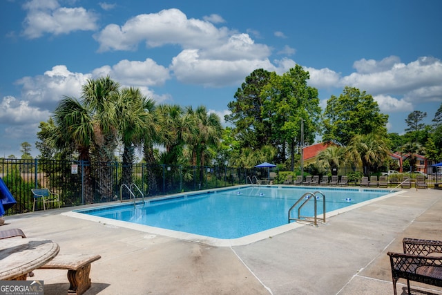 39 Helmsman Ct, Savannah, GA 31410 - community pool with a patio area and view of scattered trees