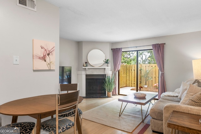 39 Helmsman Ct, Savannah, GA 31410 - living area with wood finished floors and a fireplace with flush hearth