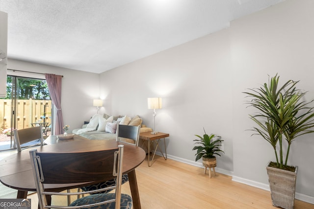 39 Helmsman Ct, Savannah, GA 31410 - dining space featuring light wood finished floors and a textured ceiling