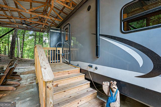 44 11th St, Ellijay, GA 30540 - doorway to property featuring stucco siding